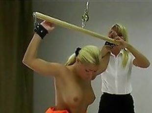 Tied up girl is whipped on her soft back